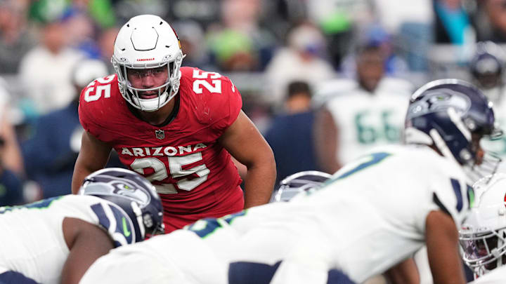 Jan 7, 2024; Glendale, Arizona, USA; Arizona Cardinals linebacker Zaven Collins (25) looks down