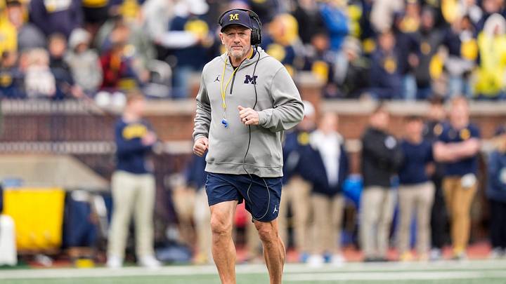 Michigan head coach Kyle Whittingham runs across the field during the spring game at Michigan Stadium in Ann Arbor on Saturday, April 18, 2026.