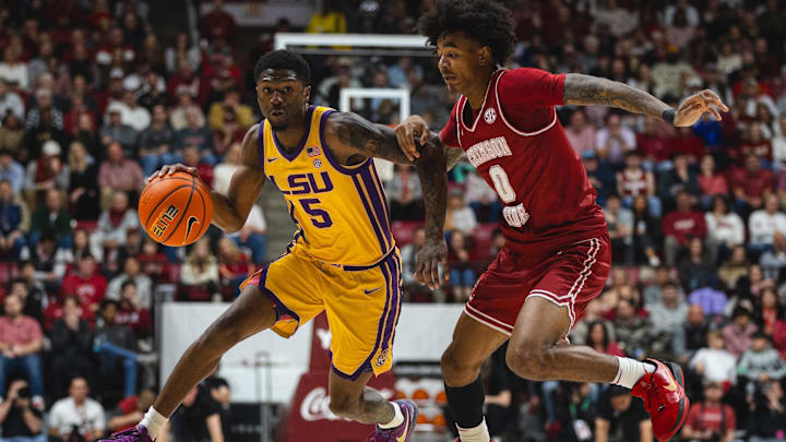 Jan 25, 2025; Tuscaloosa, Alabama, USA; LSU Tigers guard Cam Carter (5) drives the ball against Alabama Crimson Tide guard Labaron Philon (0) during the second half at Coleman Coliseum. Mandatory Credit: Will McLelland-Imagn Images Jan 25, 2025; Tuscaloosa, Alabama, USA; LSU Tigers guard Cam Carter (5) drives the ball against Alabama Crimson Tide guard Labaron Philon (0) during the second half at Coleman Coliseum. Mandatory Credit: Will McLelland-Imagn Images