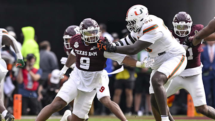 Dec 20, 2025; College Station, TX, USA; Texas A&M Aggies defensive end Cashius Howell (9) rushes the line past Miami Hurricanes offensive lineman Markel Bell (70) during the game between the Aggies and the Hurricanes at Kyle Field. Mandatory Credit: Jerome Miron-Imagn Images