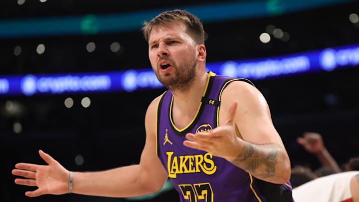 Mar 31, 2025; Los Angeles, California, USA;  Los Angeles Lakers guard Luka Doncic (77) reacts to a play during the third quarter against the Houston Rockets at Crypto.com Arena. Mandatory Credit: Kiyoshi Mio-Imagn Images