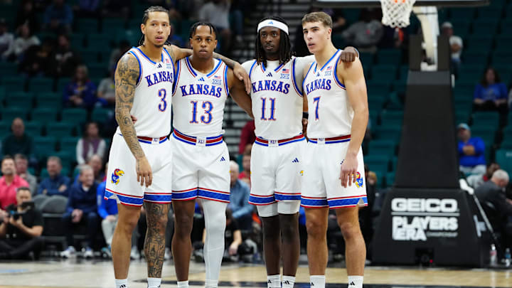 Nov 24, 2025; Las Vegas, Nevada, USA; Kansas Jayhawks guard Tre White (3), guard Elmarko Jackson (13), guard Jamari McDowell (11) and guard Kohl Rosario (7) huddle during technical foul free throws during the first half against the Notre Dame Fighting Irish in a 2025 Players Era Festival group play game at MGM Grand Garden Arena. Mandatory Credit: Stephen R. Sylvanie-Imagn Images Nov 24, 2025; Las Vegas, Nevada, USA; Kansas Jayhawks guard Tre White (3), guard Elmarko Jackson (13), guard Jamari McDowell (11) and guard Kohl Rosario (7) huddle during technical foul free throws during the first half against the Notre Dame Fighting Irish in a 2025 Players Era Festival group play game at MGM Grand Garden Arena. Mandatory Credit: Stephen R. Sylvanie-Imagn Images