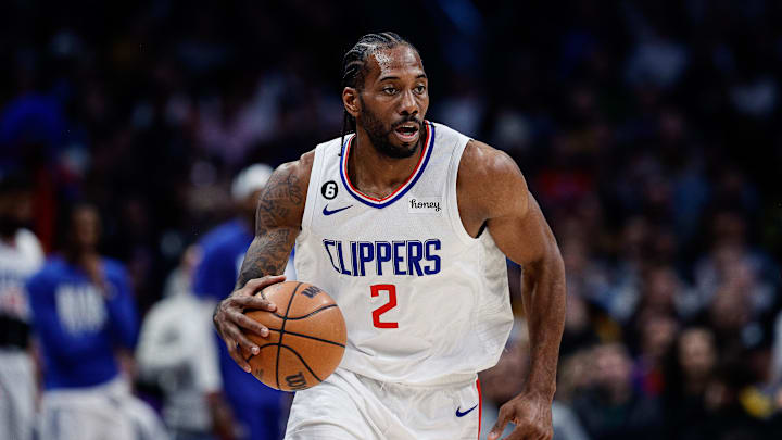 Feb 26, 2023; Denver, Colorado, USA; Los Angeles Clippers forward Kawhi Leonard (2) dribbles the ball up court in the second quarter against the Denver Nuggets at Ball Arena. 