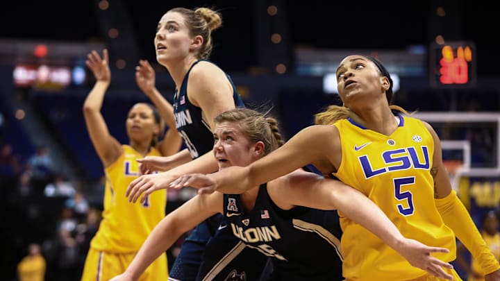 Nov 20, 2016; Baton Rouge, LA, USA; Connecticut Huskies forward Kyla Irwin (25) and Louisiana State Tigers forward Ayana Mitchell (5) go for a rebound during the second half of the game between Connecticut Huskies and Louisiana State Tigers at Maravich Assembly Center. Connecticut Huskies won 76-53. Mandatory Credit: Stephen Lew-Imagn Images