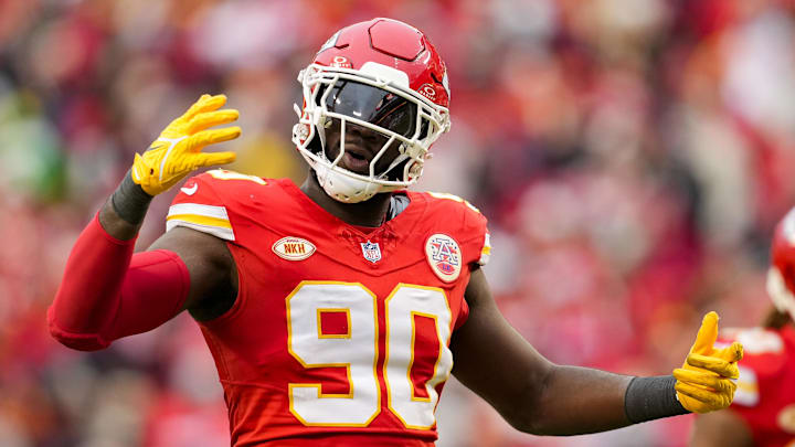 Dec 25, 2023; Kansas City, Missouri, USA; Kansas City Chiefs defensive end Charles Omenihu (90) rallies the crowd during the second half against the Las Vegas Raiders at GEHA Field at Arrowhead Stadium. Mandatory Credit: Jay Biggerstaff-Imagn Images