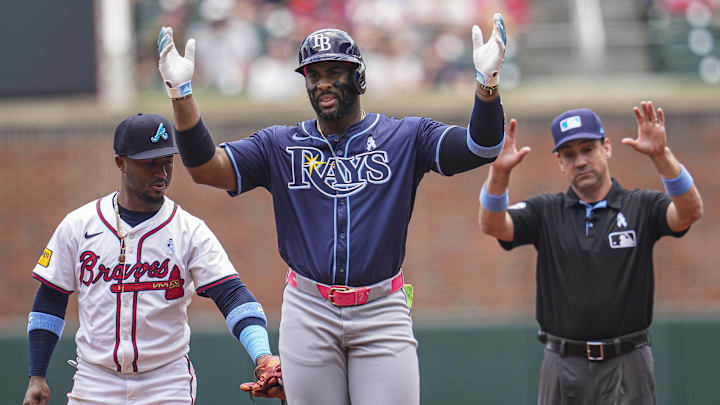 Jun 16, 2024; Cumberland, Georgia, USA; Tampa Bay Rays designated hitter Yandy Diaz (2) reacts after hitting a double against the Atlanta Braves during the first inning at Truist Park. Mandatory Credit: Dale Zanine-Imagn Images