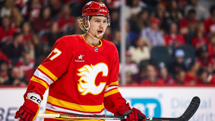 Mar 12, 2025; Calgary, Alberta, CAN; Calgary Flames center Connor Zary (47) skates against the Vancouver Canucks during the first period at Scotiabank Saddledome. Mandatory Credit: Sergei Belski-Imagn Images