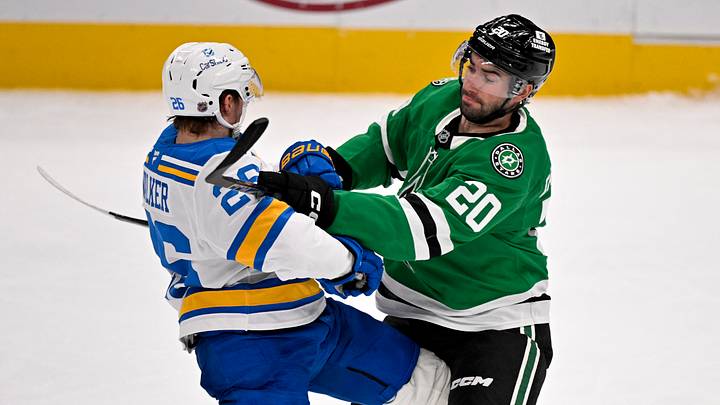 Feb 4, 2026; Dallas, Texas, USA; Dallas Stars defenseman Kyle Capobianco (20) checks St. Louis Blues left wing Nathan Walker (26) during the third period at the American Airlines Center. Mandatory Credit: Jerome Miron-Imagn Images