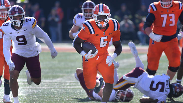 Nov 2, 2024; Champaign, Illinois, USA;  Illinois Fighting Illini running back Josh McCray (6) runs for a touchdown during the first half against the Minnesota Golden Gophers at Memorial Stadium. Mandatory Credit: Ron Johnson-Imagn Images