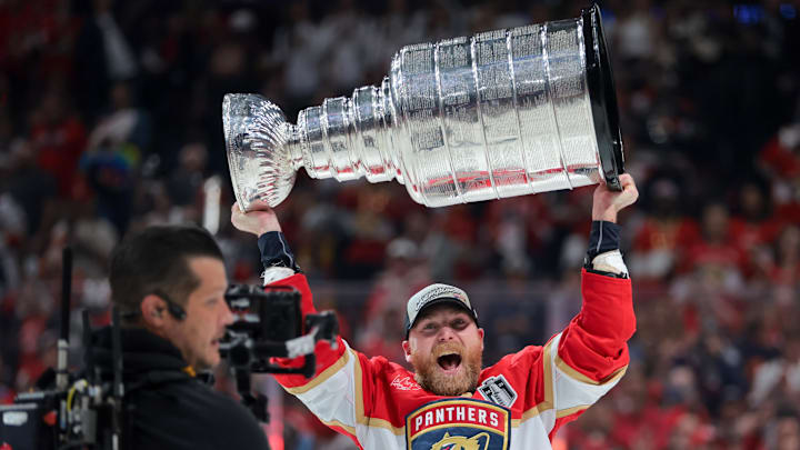 Florida Panthers center Sam Bennett hoists the Stanley Cup after winning Game 6 of the 2025 Stanley Cup Final against the Edmonton Oilers at Amerant Bank Arena.