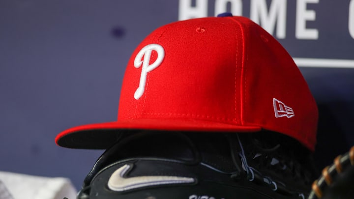 May 26, 2023; Atlanta, Georgia, USA; A detailed view of a Philadelphia Phillies hat and glove on the bench against the Atlanta Braves in the seventh inning at Truist Park. May 26, 2023; Atlanta, Georgia, USA; A detailed view of a Philadelphia Phillies hat and glove on the bench against the Atlanta Braves in the seventh inning at Truist Park.