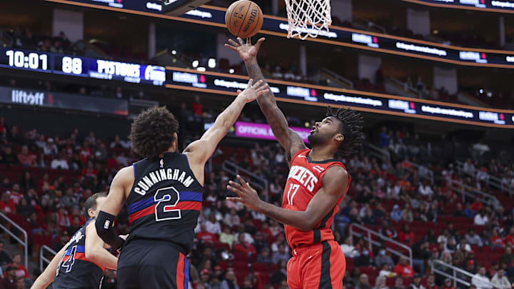 Jan 1, 2024; Houston, Texas, USA; Houston Rockets forward Tari Eason (17) shoots the ball as Detroit Pistons guard Cade Cunningham (2) defends: Troy Taormina-Imagn Images