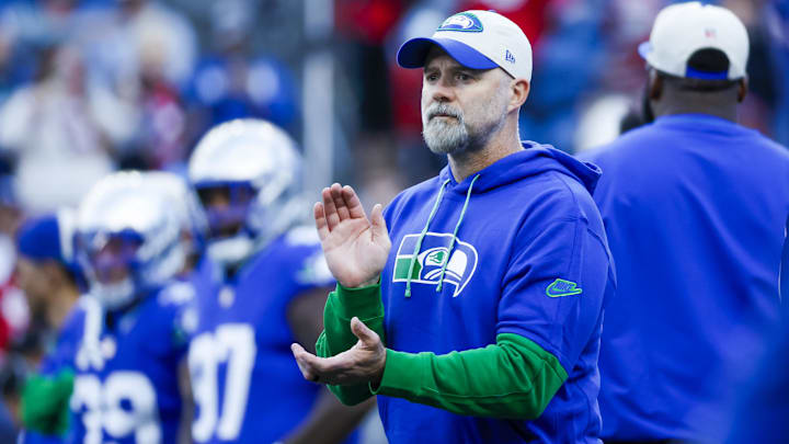 Oct 10, 2024; Seattle, Washington, USA; Seattle Seahawks offensive coordinator Ryan Grubb watches pregame warmups against the San Francisco 49ers at Lumen Field.