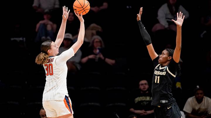 Illinois forward Cearah Parchment (30) shoots past Colorado forward Logyn Greer (11) during the first half in the first round of the NCAA college basketball tournament at Memorial Gym in Nashville, Tenn., Saturday, March 21, 2026.