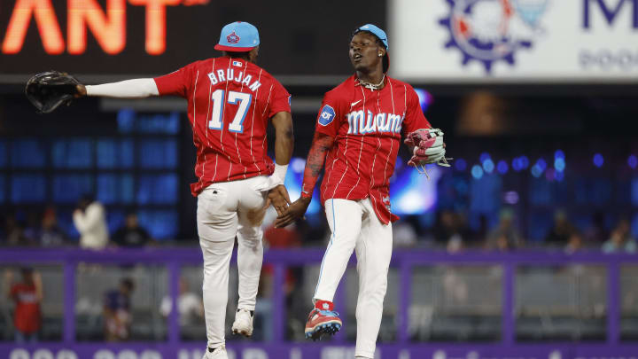 Jul 6, 2024; Miami, Florida, USA; Miami Marlins shortstop Vidal Brujan (17) and center fielder Jazz Chisholm Jr. (2) celebrate their win against the Chicago White Sox at loanDepot Park. Mandatory Credit: Rhona Wise-USA TODAY Sports