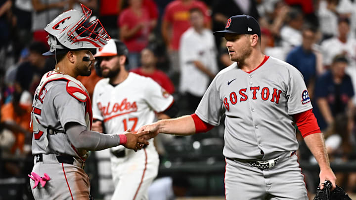 Aug 26, 2025; Baltimore, Maryland, USA; Boston Red Sox pitcher Justin Wilson (right) and catcher Carlos Narvaez (left) celebrate the win against the Baltimore Orioles at Oriole Park at Camden Yards. Mandatory Credit: James A. Pittman-Imagn Images