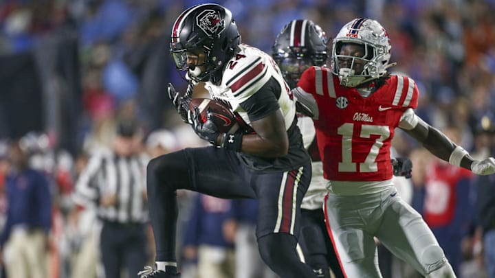 Nov 1, 2025; Oxford, Mississippi, USA; South Carolina Gamecocks defensive back Jalon Kilgore (24) intercepts a pass intended for Mississippi Rebels wide receiver Winston Watkins (17) during the second quarter at Vaught-Hemingway Stadium. Mandatory Credit: Petre Thomas-Imagn Images