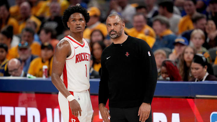 May 2, 2025; San Francisco, California, USA; Houston Rockets forward Amen Thompson (1) meets with Houston Rockets head coach Ime Udoka during a break in the action against the Golden State Warriors in the fourth quarter of game six of the first round for the 2025 NBA Playoffs at Chase Center. Mandatory Credit: Cary Edmondson-Imagn Images