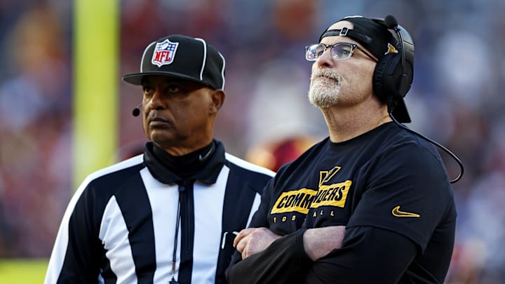 Washington Commanders head coach Dan Quinn watches a replay on the video board during the third quarter against the Dallas Cowboys.