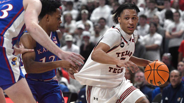 Texas Tech's guard Darrion Williams (5) dribbles the ball against Kansas in a Big 12 basketball game, Monday, Feb. 12, 2024, at United Supermarkets Arena.