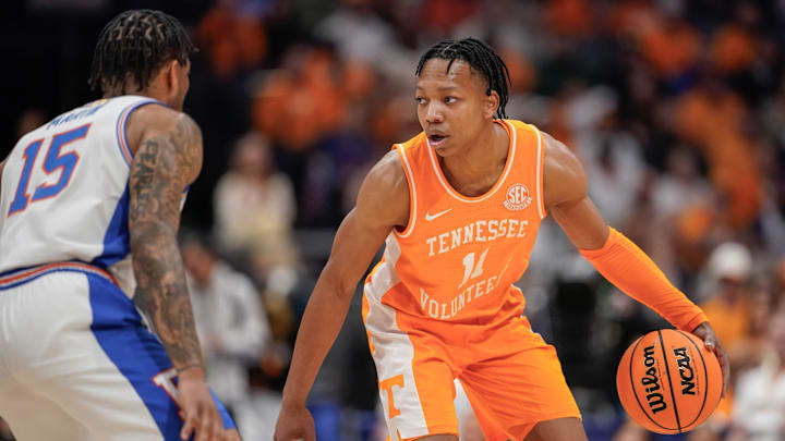 Tennessee guard Jordan Gainey (11) is guarded by Florida guard Alijah Martin (15) during the first half of the Southeastern Conference tournament championship at Bridgestone Arena in Nashville, Tenn., Sunday, March 16, 2025.