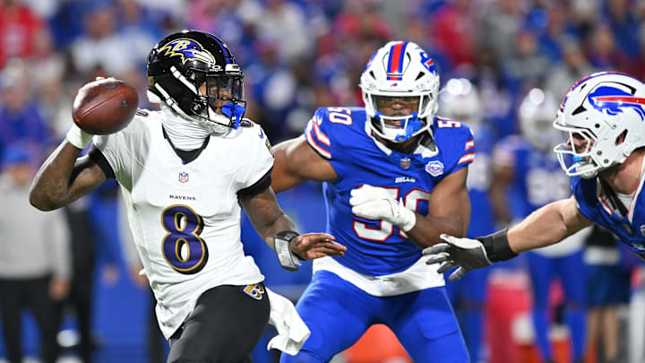 Sep 7, 2025; Orchard Park, New York, USA;  Baltimore Ravens quarterback Lamar Jackson (8) runs the ball during the fourth quarter against the Buffalo Bills at Highmark Stadium.