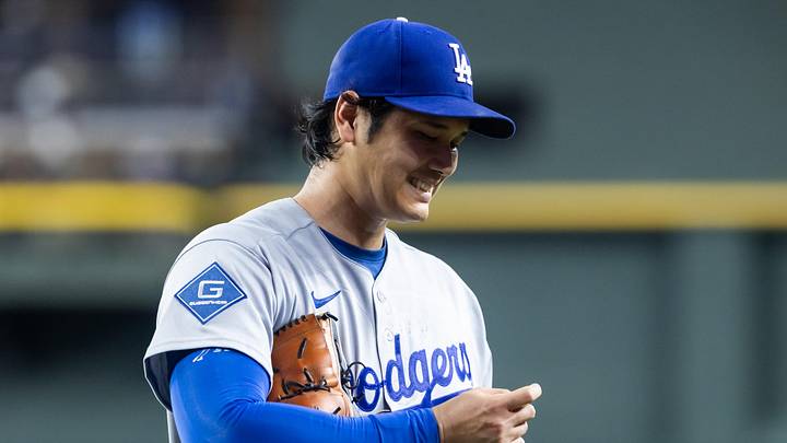 Jun 3, 2026; Phoenix, Arizona, USA; Los Angeles Dodgers pitcher Shohei Ohtani reacts as he looks at his finger in the third inning against the Arizona Diamondbacks at Chase Field. Mandatory Credit: Mark J. Rebilas-Imagn Images
