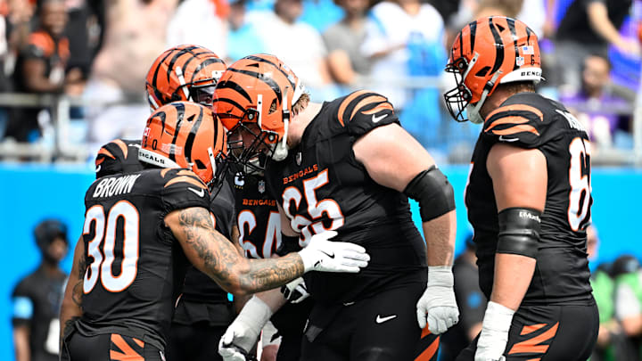 Sep 29, 2024; Charlotte, North Carolina, USA; Cincinnati Bengals running back Chase Brown (30) celebrates with guard Alex Cappa (65) after scoring a touchdown in the first quarter at Bank of America Stadium. Mandatory Credit: Bob Donnan-Imagn Images Sep 29, 2024; Charlotte, North Carolina, USA; Cincinnati Bengals running back Chase Brown (30) celebrates with guard Alex Cappa (65) after scoring a touchdown in the first quarter at Bank of America Stadium. Mandatory Credit: Bob Donnan-Imagn Images
