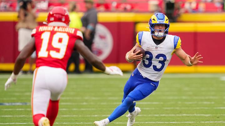 Aug 15, 2026; Kansas City, Missouri, USA; Los Angeles Rams running back Dean Connors (33) runs with the ball against Kansas City Chiefs cornerback D'Arco Perkins-McAllister (19) during the second half at at Arrowhead Stadium. Mandatory Credit: Jay Biggerstaff-Imagn Images Aug 15, 2026; Kansas City, Missouri, USA; Los Angeles Rams running back Dean Connors (33) runs with the ball against Kansas City Chiefs cornerback D'Arco Perkins-McAllister (19) during the second half at at Arrowhead Stadium. Mandatory Credit: Jay Biggerstaff-Imagn Images