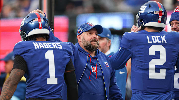 Dec 29, 2024; East Rutherford, New Jersey, USA; New York Giants head coach Brian Daboll congratulates wide receiver Malik Nabers (1) and quarterback Drew Lock (2) after a touchdown during the second half against the Indianapolis Colts at MetLife Stadium. Dec 29, 2024; East Rutherford, New Jersey, USA; New York Giants head coach Brian Daboll congratulates wide receiver Malik Nabers (1) and quarterback Drew Lock (2) after a touchdown during the second half against the Indianapolis Colts at MetLife Stadium.