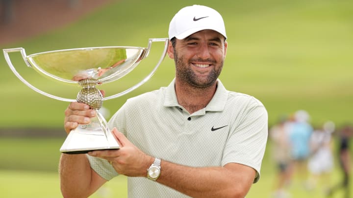Sep 1, 2024; Atlanta, Georgia, USA; Scottie Scheffler celebrates winning the TOUR Championship golf tournament. Mandatory Credit: John David Mercer-Imagn Images