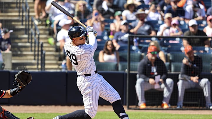 Feb 21, 2026; Tampa, Florida, USA; New York Yankees outfielder Aaron Judge (99) hits a home run against the Detroit Tigers during the third inning in a Spring Training game at George M. Steinbrenner Field. Mandatory Credit: Morgan Tencza-Imagn Images