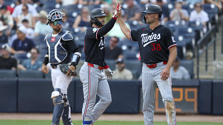 Mar 5, 2026; Tampa, Florida, USA; Minnesota Twins right fielder Matt Wallner (38) reacts to center fielder James Outman (30) two-run home run against the New York Yankees in the fifth inning during spring training at George M. Steinbrenner Field.