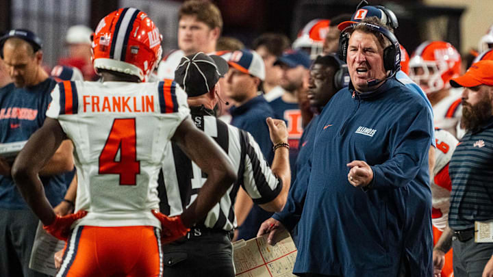 Sep 20, 2024; Lincoln, Nebraska, USA; Illinois Fighting Illini head coach Bret Bielema talks with an official during the second quarter against the Nebraska Cornhuskers at Memorial Stadium. Mandatory Credit: Dylan Widger-Imagn Images