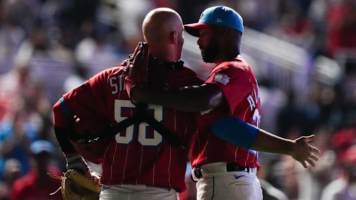 Aug 12, 2023; Miami, Florida, USA; Miami Marlins relief pitcher Jorge Lopez (52) embraces Miami Marlins starting pitcher Sandy Alcantara (22) after beating the New York Yankees at loanDepot Park. Mandatory Credit: Rich Storry-Imagn Images