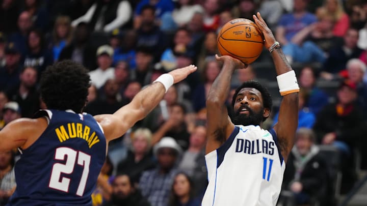 Nov 10, 2024; Denver, Colorado, USA; Dallas Mavericks guard Kyrie Irving (11) prepares to shoot the ball in the fourth quarter against the Denver Nuggets at Ball Arena. Mandatory Credit: Ron Chenoy-Imagn Images