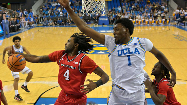 Feb 3, 2026; Los Angeles, California, USA;  Rutgers Scarlet Knights forward Bryce Dortch (4) beats UCLA Bruins forward Xavier Booker (1) to a rebound in the first half at Pauley Pavilion presented by Wescom Financial. Mandatory Credit: Jayne Kamin-Oncea-Imagn Images