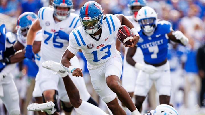 Sep 6, 2025; Lexington, Kentucky, USA; Mississippi Rebels quarterback Austin Simmons (13) runs the ball during the second quarter against the Kentucky Wildcats at Kroger Field. Mandatory Credit: Jordan Prather-Imagn Images