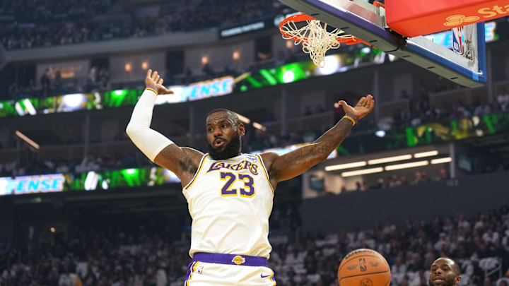 Los Angeles Lakers forward LeBron James gestures after dunking against the Golden State Warriors.