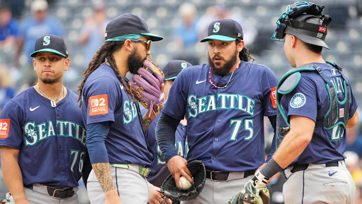 Sep 18, 2025; Kansas City, Missouri, USA; Seattle Mariners relief pitcher Andres Munoz (75) and catcher Cal Raleigh (29) conference at the mound against the Kansas City Royals during the ninth inning at Kauffman Stadium. Mandatory Credit: Denny Medley-Imagn Images Sep 18, 2025; Kansas City, Missouri, USA; Seattle Mariners relief pitcher Andres Munoz (75) and catcher Cal Raleigh (29) conference at the mound against the Kansas City Royals during the ninth inning at Kauffman Stadium. Mandatory Credit: Denny Medley-Imagn Images