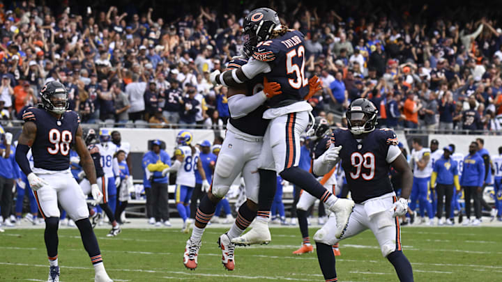 DeMarcus Walker and Darrell Taylor celebrate the clinching interception by the Bears.