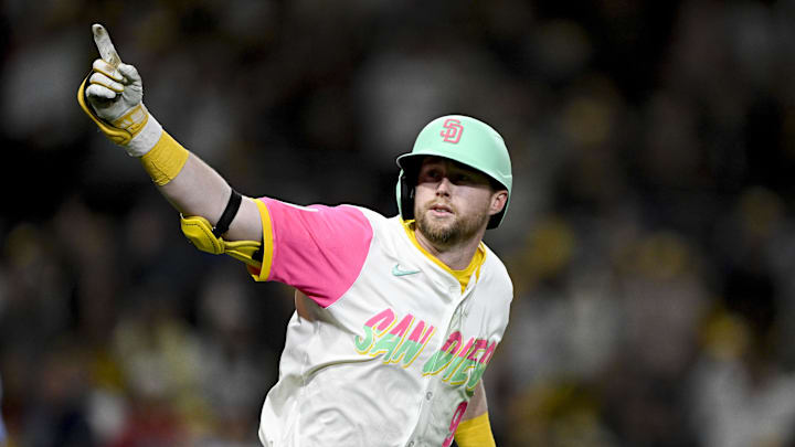 Mar 28, 2025; San Diego, California, USA; San Diego Padres first baseman Jake Cronenworth (9) celebrates after hitting a solo home run during the eighth inning against the Atlanta Braves at Petco Park. Mandatory Credit: Denis Poroy-Imagn Images