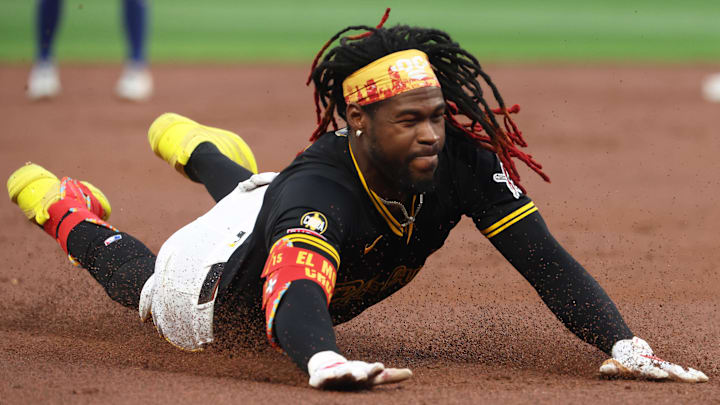 Pittsburgh Pirates center fielder Oneil Cruz (15) slides into third base on an RBI triple against the Chicago Cubs during the first inning at PNC Park. 
