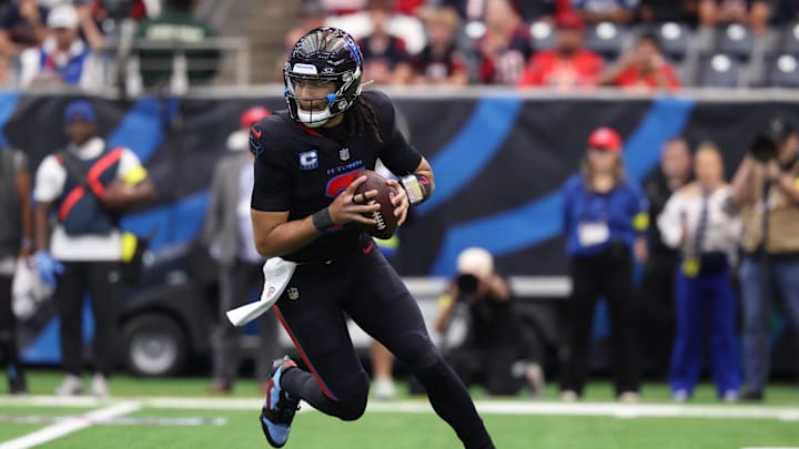 Jan 4, 2026; Houston, Texas, USA;  Houston Texans quarterback C.J. Stroud (7) looks downfield as he rolls out against the Indianapolis Colts during the first half at NRG Stadium. Mandatory Credit: Troy Taormina-Imagn Images
