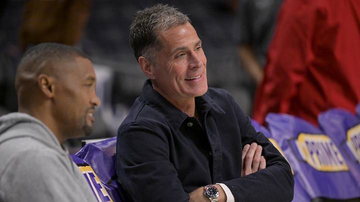 Nov 21, 2024; Los Angeles, California, USA;  Los Angeles Lakers general manager Rob Pelinka, right, talks with Leroy Sims, director of player performance & health, prior to the game against the Orlando Magic at Crypto.com Arena. Mandatory Credit: Jayne Kamin-Oncea-Imagn Images