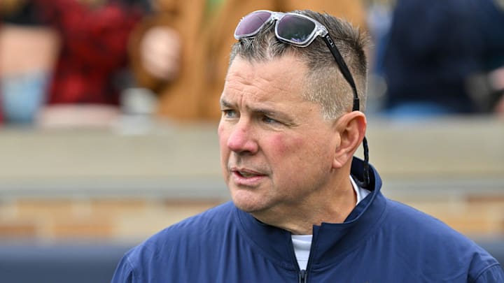 Nov 16, 2024; South Bend, Indiana, USA; Notre Dame Fighting Irish defensive coordinator Al Golden watches warmups before a game against the Virginia Cavaliers at Notre Dame Stadium. 