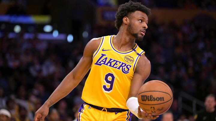 Mar 19, 2025; Los Angeles, California, USA;  Los Angeles Lakers guard Bronny James (9) inbound the ball in the second half against the Denver Nuggets at Crypto.com Arena. Mandatory Credit: Jayne Kamin-Oncea-Imagn Images