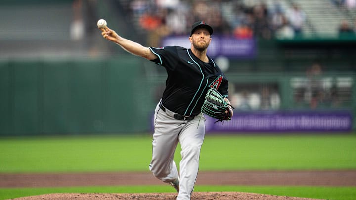 May 12, 2025; San Francisco, California, USA; Arizona Diamondbacks starting pitcher Merrill Kelly (29) delivers a pitch against the San Francisco Giants during the first inning at Oracle Park. Mandatory Credit: Neville E. Guard-Imagn Images May 12, 2025; San Francisco, California, USA; Arizona Diamondbacks starting pitcher Merrill Kelly (29) delivers a pitch against the San Francisco Giants during the first inning at Oracle Park. Mandatory Credit: Neville E. Guard-Imagn Images