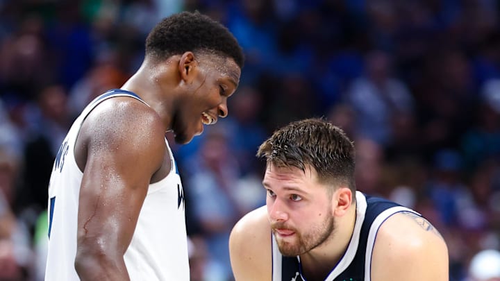 May 28, 2024; Dallas, Texas, USA; Minnesota Timberwolves guard Anthony Edwards (5) speaks to Dallas Mavericks guard Luka Doncic (77) during the fourth quarter during game four of the western conference finals for the 2024 NBA playoffs at American Airlines Center. Mandatory Credit: Kevin Jairaj-Imagn Images