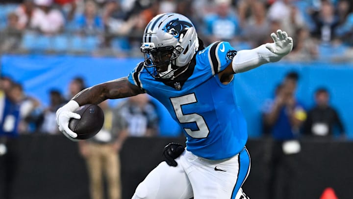 Aug 8, 2025; Charlotte, North Carolina, USA; Carolina Panthers running back Rico Dowdle (5) with the ball as Cleveland Browns linebacker Winston Reid (59) defends in the second quarter at Bank of America Stadium. Mandatory Credit: Bob Donnan-Imagn Images Aug 8, 2025; Charlotte, North Carolina, USA; Carolina Panthers running back Rico Dowdle (5) with the ball as Cleveland Browns linebacker Winston Reid (59) defends in the second quarter at Bank of America Stadium. Mandatory Credit: Bob Donnan-Imagn Images